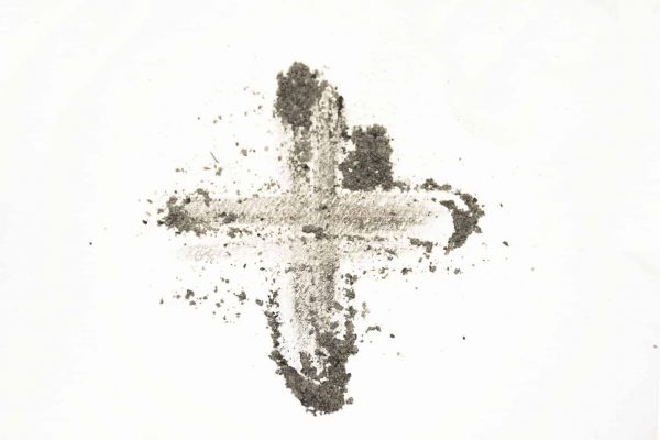A cross with ashes is drawn against a white background.